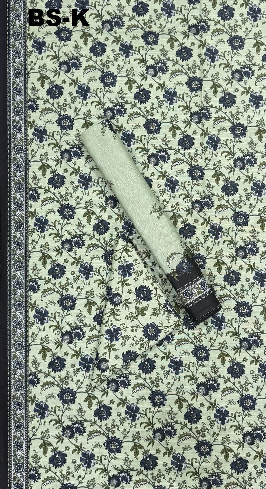 Sage green fabric with navy floral print