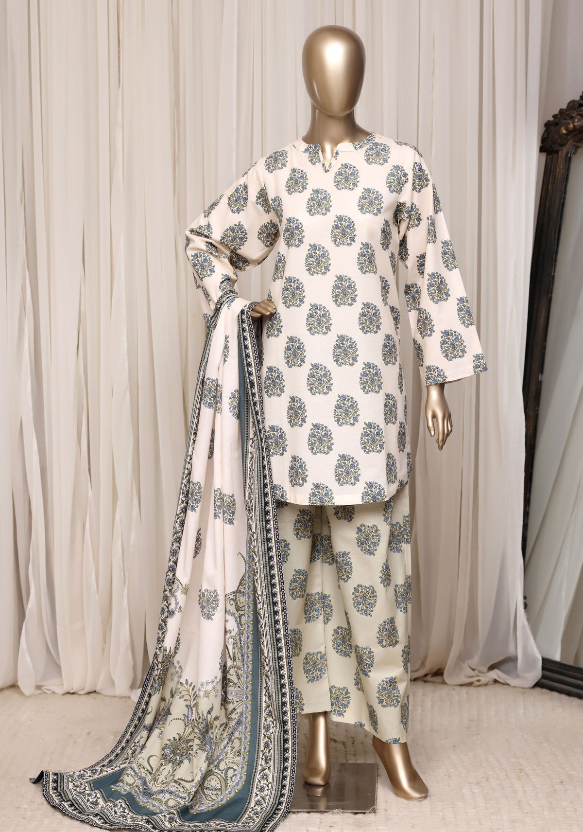 Sadabahar ivory blue khaddar suit pose 1