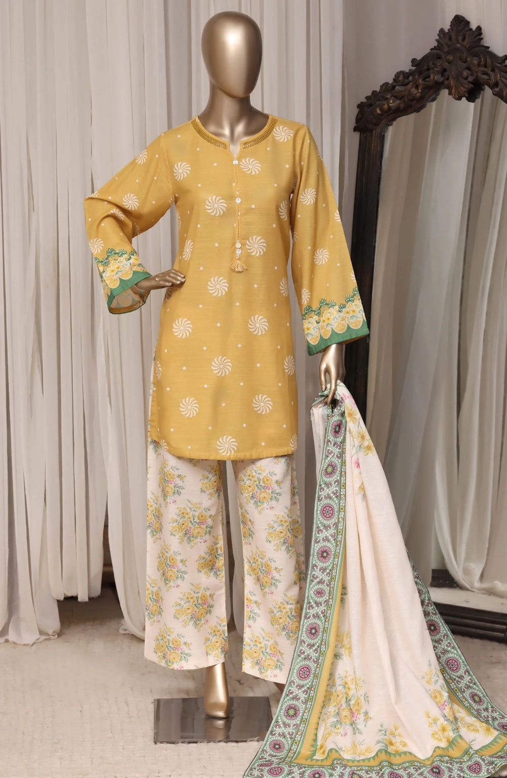 Sada Bahar mustard yellow stitched printed khaddar three-piece suit, front view