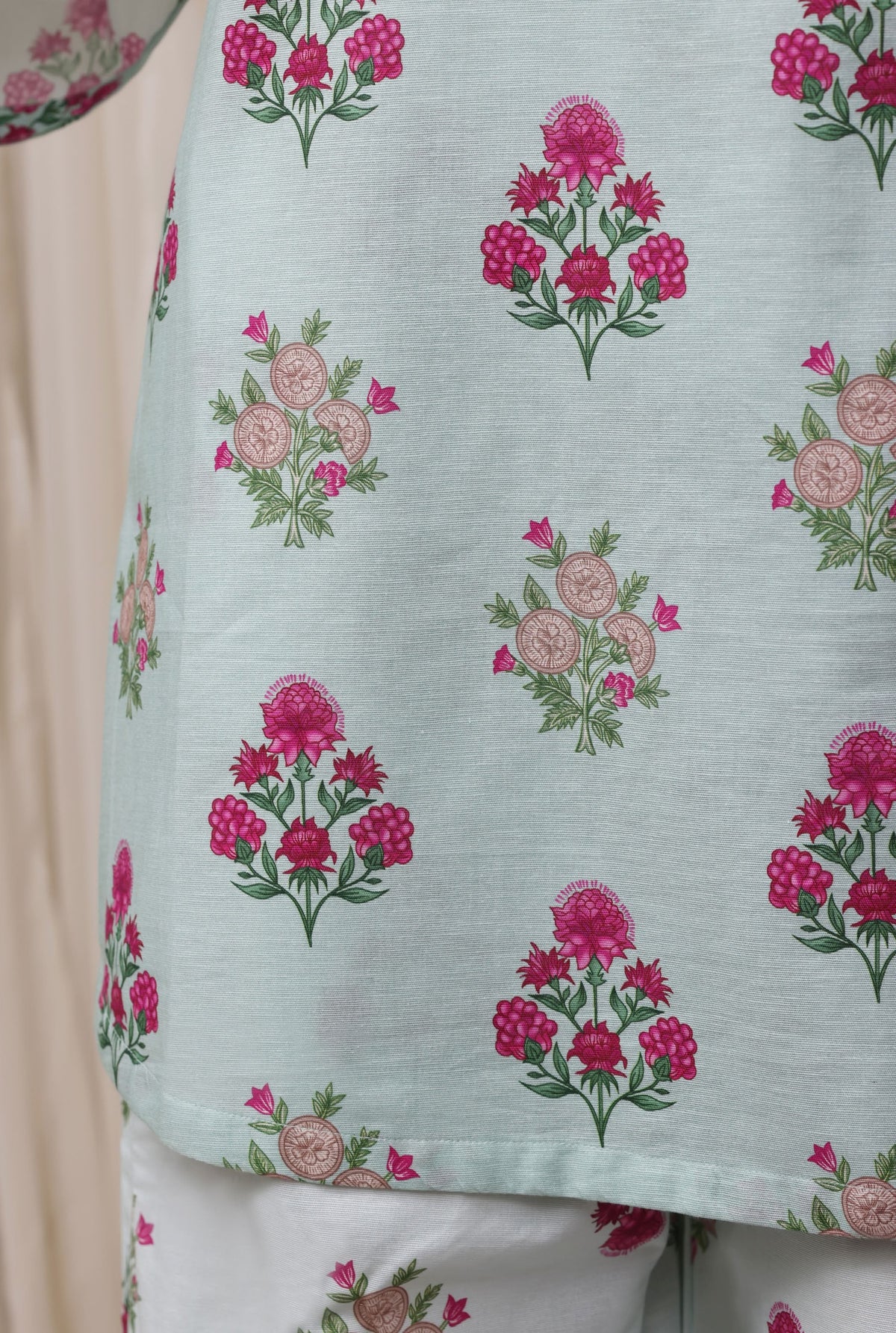 Mint green suit print detail